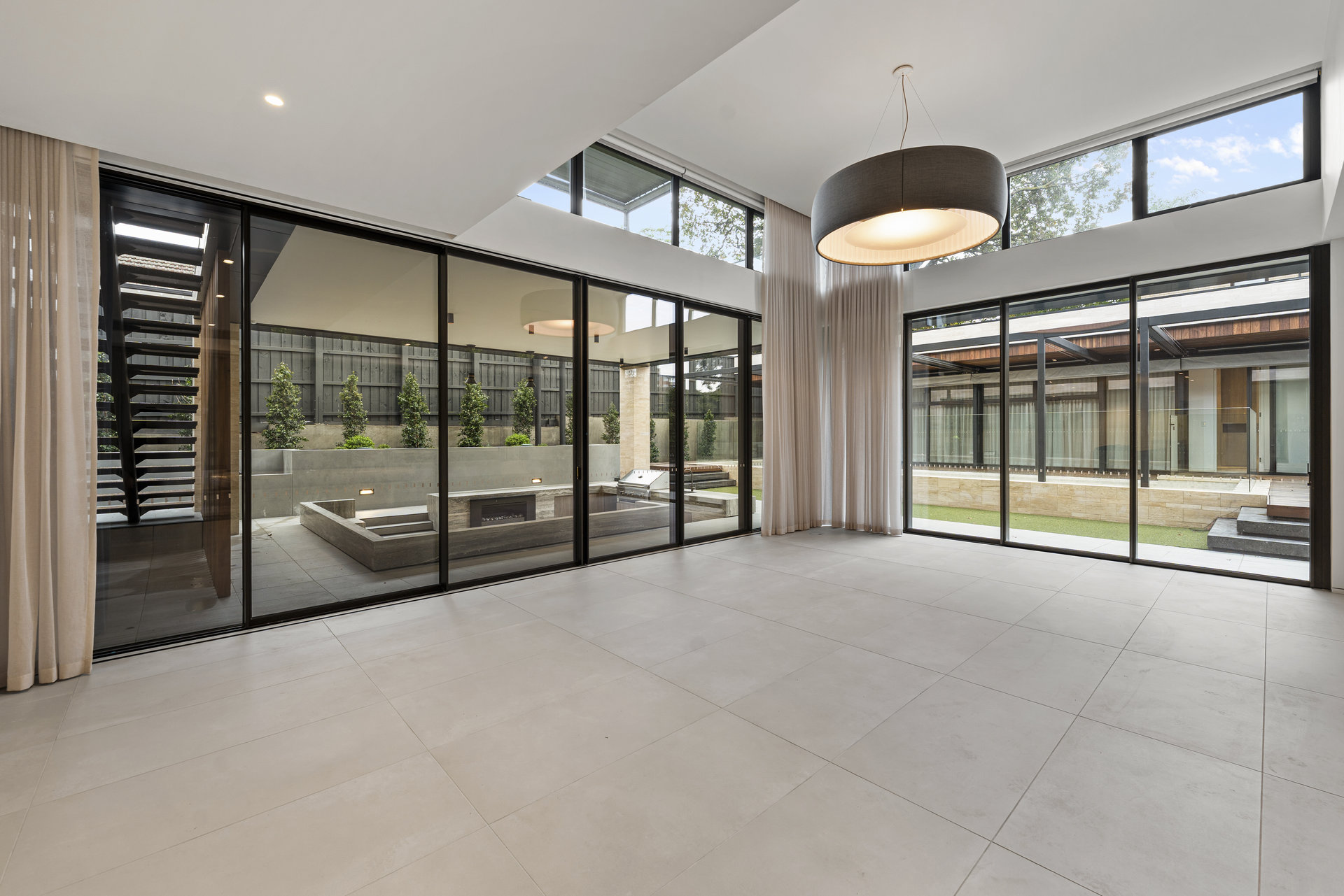 Large-format tiled indoor and outdoor living area